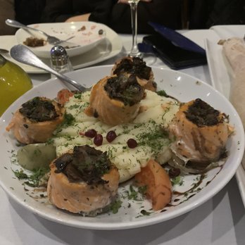 Marani - salmon filets wrapped in sautéed mushrooms and served on top of parslied (or dill) mashed potatoes - Mediterranean Near Me - Rego Park, New York Marani - salmon filets wrapped in sautéed mushrooms and served on top of parslied (or dill) mashed potatoes - Mediterranean Near Me - Rego Park, New York