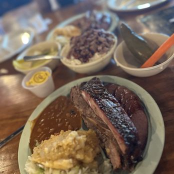 The Salt Lick BBQ - Thurman plate. Brisket sausage and pork ribs with potato salad and coleslaw - Barbeque Near Me - Round Rock, Texas