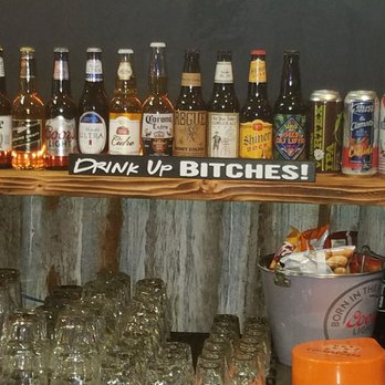Nauti Mermaid - a shelf full of beer bottles - Dive Bars Near Me - Port Orchard, Washington Nauti Mermaid - a shelf full of beer bottles - Dive Bars Near Me - Port Orchard, Washington
