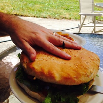 Family Kitchen - a person holding a sandwich on a plate - American Near Me - Port Angeles, Washington Family Kitchen - a person holding a sandwich on a plate - American Near Me - Port Angeles, Washington