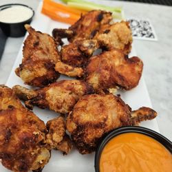 Leinie Lodge & Beer Garden - Wings are lightly breaded... I got sauce on side