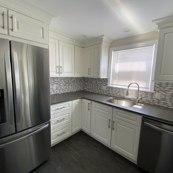 FRM Home Improvements - a kitchen with stainless steel appliances - General Contractors Near Me - Coram, New York