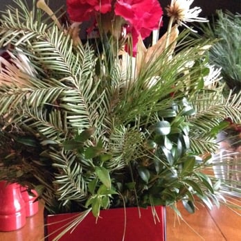 Neffsville Flower Shoppe - This is a 4 sided cube arrangement that can only be used against something because it's not designed four sided. Ridiculous. - Florists Near Me - Lancaster, Pennsylvania