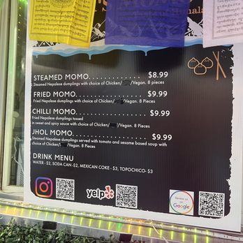 Monk's Momo - a menu on a window - Food Trucks Near Me - Austin, Texas