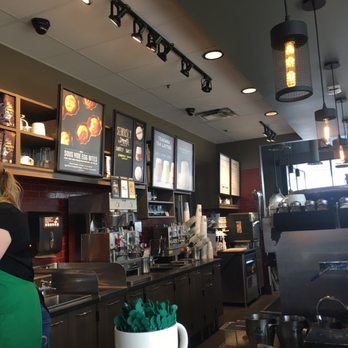 Starbucks - a woman working at a coffee shop - Coffee & Tea Near Me - Pickering, Ontario