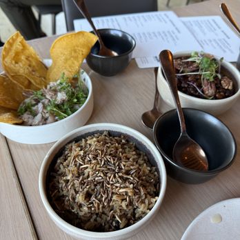 Owamni - Trout with tostada, wild rice, and beans with pecans on top - New American Near Me - Minneapolis, Minnesota Owamni - Trout with tostada, wild rice, and beans with pecans on top - New American Near Me - Minneapolis, Minnesota