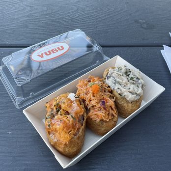 Yubu - a plate of food and a bagel on a table - Sushi Bars Near Me - Toronto, Ontario