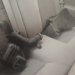 AutoHaus Towing & Recovery - Car pieces thrown into the backseat. The image doesn't show it, but there were oil stains on the fabric.