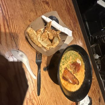 Matsunoki Ramen - Spicy ramen on the right. Pot stickers from another place in the food hall on the left - Ramen Near Me - Portland, Oregon Matsunoki Ramen - Spicy ramen on the right. Pot stickers from another place in the food hall on the left - Ramen Near Me - Portland, Oregon