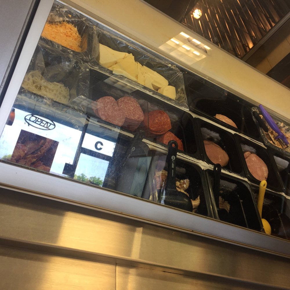a variety of food items in a display case a variety of food items in a display case