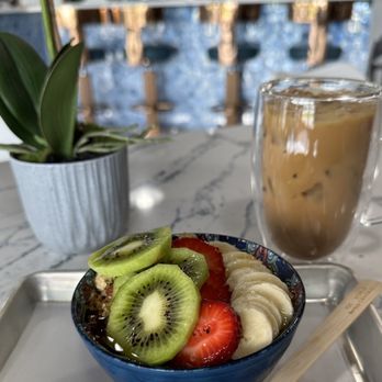 Jona Bells - a bowl of fruit and a glass of iced coffee - Acai Bowls Near Me - Lakeland, Florida Jona Bells - a bowl of fruit and a glass of iced coffee - Acai Bowls Near Me - Lakeland, Florida