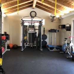 Jamie Ambler Fitness - Dual stack, smith bar, Inspire Fitness FT2 functional trainer. GHD by Legends Fitness, leg press machine. Cardio equipment. Trx. Open space.