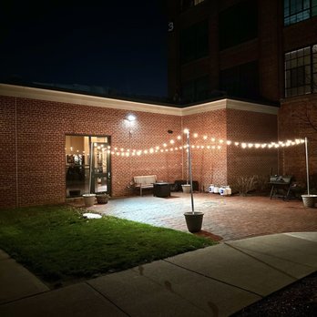 Avenue N - a courtyard at night with string lights - New American Near Me - Rumford, Rhode Island