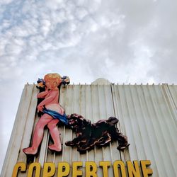 The Coppertone Girl Sign