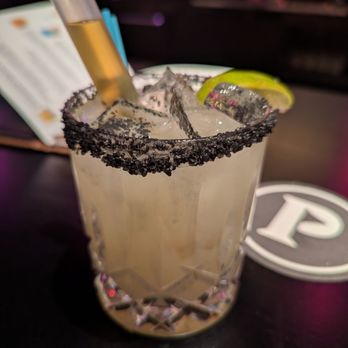 Puttshack - Ultimate Top Shelf Margarita. $16. Dulce Vida Blanco Tequila, Cointreau, lime sour, black lava salt rim, Grand Marnier Supertube. - Mini Golf Near Me - Dunwoody, Georgia