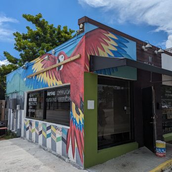 11 Chicks - a colorful building with a bird painted on it - Venezuelan Near Me - Saint Petersburg, Florida