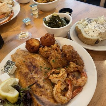 Halterman’s Eatery - Platter trio (grouper, shrimp, oysters) with a baked potato and greens - Seafood Near Me - Manquin, Virginia Halterman’s Eatery - Platter trio (grouper, shrimp, oysters) with a baked potato and greens - Seafood Near Me - Manquin, Virginia