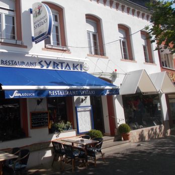 Syrtaki - Blick auf die Terrasse am Morgen - Greek Near Me - Euskirchen, NW Syrtaki - Blick auf die Terrasse am Morgen - Greek Near Me - Euskirchen, NW