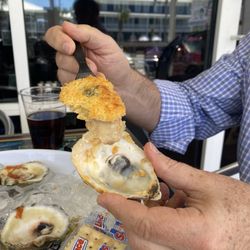 The Station Raw Bar - Oyster Rockefeller. Look at the size of the oyster!!!