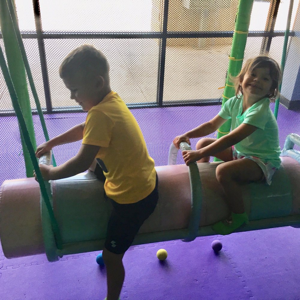 Hooray Indoor Party Playground - Swinging siblings - Indoor Playcenter Near Me - Katy, Texas