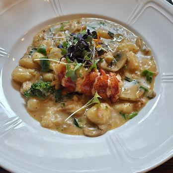 The Colonel’s Club - LOBSTER GNOCCHI  $48.00  lobster fricassee, wild mushrooms, roasted broccolini, shaved parmesan - American Near Me - Baton Rouge, Louisiana