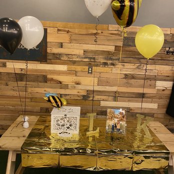 'Olo Pizza -  a table with balloons and a sign - Pizza Near Me - Worcester, Massachusetts