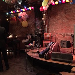 a stage with balloons and a guitar a stage with balloons and a guitar