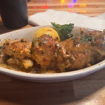Peg Leg Pete's - Peg Leg Pete's Stuffed Shrimp Four gulf shrimp filled with crab meat stuffing, then broiled and topped with their signature Crawfish Julie - Seafood Near Me - Pensacola Beach, Florida