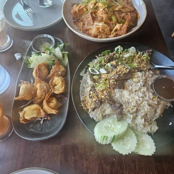 Thai Orchid - Pad Thai with chicken, shrimp, and fried tofu, plus Tiger Cry Beef, and Crab Rangoon. - Thai Near Me - Kansas City, Missouri Thai Orchid - Pad Thai with chicken, shrimp, and fried tofu, plus Tiger Cry Beef, and Crab Rangoon. - Thai Near Me - Kansas City, Missouri