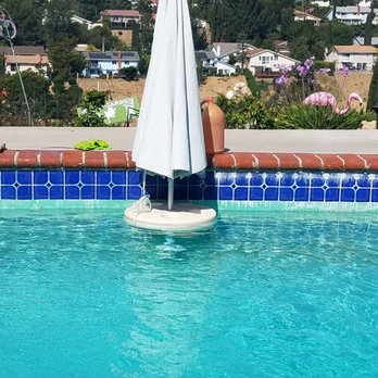 NAS Pool Service - A before and after shot of 10 year old calcium on the tile that was removed Within one and a half hours. - Pool Cleaners Near Me NAS Pool Service - A before and after shot of 10 year old calcium on the tile that was removed Within one and a half hours. - Pool Cleaners Near Me
