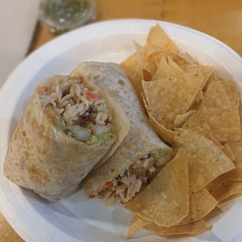 Rubio's Coastal Grill - Caption: picture of shrimp and bacon burrito on a white plate with a few corn tortilla chips - Mexican Near Me - San Diego, California Rubio's Coastal Grill - Caption: picture of shrimp and bacon burrito on a white plate with a few corn tortilla chips - Mexican Near Me - San Diego, California