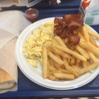 Las Olas Cafe - Breakfast combo with bacon, French fries, scrambled eggs, and French bread - Cuban Near Me - Miami Beach, Florida Las Olas Cafe - Breakfast combo with bacon, French fries, scrambled eggs, and French bread - Cuban Near Me - Miami Beach, Florida