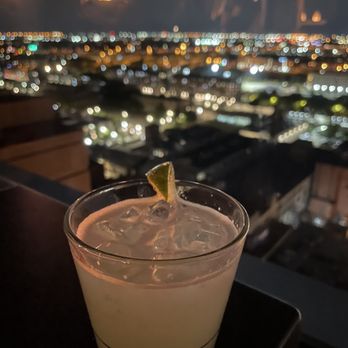 VU Rooftop - a drink with a view of a city at night - Lounges Near Me - Chicago, Illinois