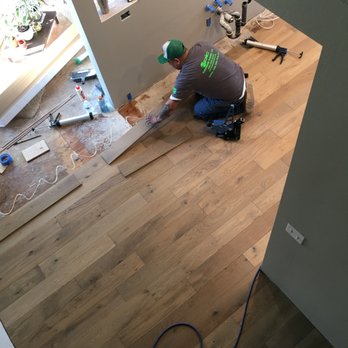Epic Hardwood Floors - a man working on the floor - Flooring Near Me - Tacoma, Washington
