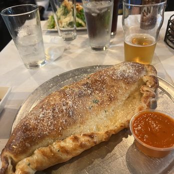Bella Italia - The big as your head Calzone - Porcellina Calzone (Meat Lovers) - Pizza Near Me - Denver, Colorado Bella Italia - The big as your head Calzone - Porcellina Calzone (Meat Lovers) - Pizza Near Me - Denver, Colorado