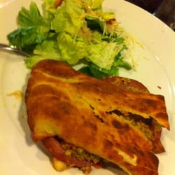 Isabella's Pizzeria - NEVER AGAIN This is 3 strikes ur out! This is supposed to be the 1/2 Muffaletta and salad. Can't even get a knife through it!