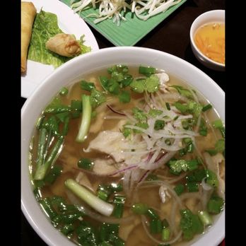 Pho Ba Co - a bowl of soup and a plate of vegetables - Vietnamese Near Me - Warren, Michigan Pho Ba Co - a bowl of soup and a plate of vegetables - Vietnamese Near Me - Warren, Michigan
