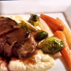 The University Club & Restaurant - Seared Venison atop Parsnip puree, and roast vegetables.