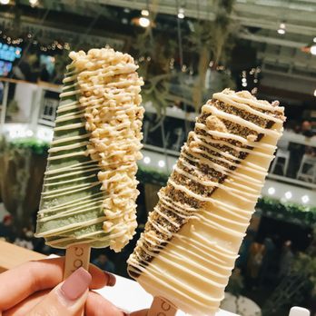 Popbar - I got vanilla with vanilla drizzle and chocolate dipping, sprinkled with cookie crumps - Desserts Near Me - Anaheim, California Popbar - I got vanilla with vanilla drizzle and chocolate dipping, sprinkled with cookie crumps - Desserts Near Me - Anaheim, California