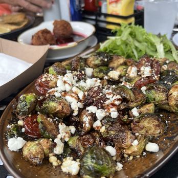 Outback Crab Shack - Brussel sprouts with goat chases and sausage - Seafood Near Me - Saint Augustine, Florida Outback Crab Shack - Brussel sprouts with goat chases and sausage - Seafood Near Me - Saint Augustine, Florida