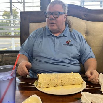 El Maguey - a man sitting at a table with a plate of food - Mexican Near Me - Clarksville, Indiana El Maguey - a man sitting at a table with a plate of food - Mexican Near Me - Clarksville, Indiana