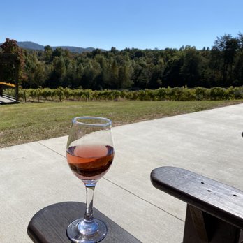 Ott Vineyards And Winery - a glass of wine on a picnic table - Wine Tasting Room Near Me - Ellijay, Georgia Ott Vineyards And Winery - a glass of wine on a picnic table - Wine Tasting Room Near Me - Ellijay, Georgia