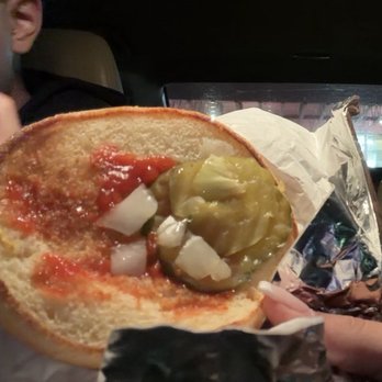 Dick's Hamburgers - my 5 pieces of onion, next to the 2 paperthin pickles, as well as the miniature piece of lettuce. - Burgers Near Me - Spokane, Washington Dick's Hamburgers - my 5 pieces of onion, next to the 2 paperthin pickles, as well as the miniature piece of lettuce. - Burgers Near Me - Spokane, Washington