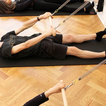 Core Burn Pilates - Using the pull down bar for the Tower class - Pilates Near Me - New York, New York