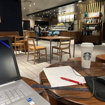 Starbucks - a laptop on a table in a coffee shop - Coffee & Tea Near Me - Walnut, California
