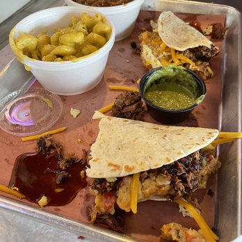 Hurtado Barbecue - Loaded breakfast taco (half-eaten), macaroni, and beans - Barbeque Near Me - Arlington, Texas Hurtado Barbecue - Loaded breakfast taco (half-eaten), macaroni, and beans - Barbeque Near Me - Arlington, Texas