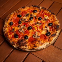 Pia's Not Just Pizza - La Maria pizza: pepperoni, mushrooms, black olives and bell peppers