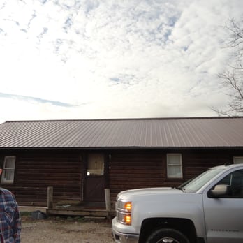 JLS Contracting - a man standing in front of a cabin - General Contractors Near Me - Chillicothe, Ohio