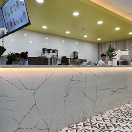 a restaurant with a marble counter a restaurant with a marble counter