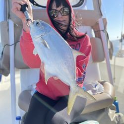 Fort Myers Fishing Adventures - Pompano wild. I thought Kellie was bringing in an Orca it fought so hard.